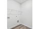 Laundry room with hookups and white wire shelving for organizing essentials at 8253 Vibrant Loop, Longs, SC 29568