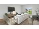 Bright open living room with large window and sliding doors to backyard at 8253 Vibrant Loop, Longs, SC 29568