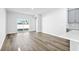 Bright living area with wood flooring and a sliding door to the patio at 8253 Vibrant Loop, Longs, SC 29568