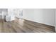 Open-concept living area with wood floors, gray cabinets, and ample natural light at 8253 Vibrant Loop, Longs, SC 29568