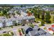 Aerial view of a neighborhood with townhouses, green spaces, and a small lake at 861 Murray Ave., Myrtle Beach, SC 29577