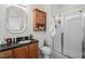 Bathroom featuring a glass door shower, dark countertop and vanity, and storage at 861 Murray Ave., Myrtle Beach, SC 29577