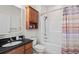 Bathroom featuring a shower, vanity with black countertop, and modern fixtures at 861 Murray Ave., Myrtle Beach, SC 29577