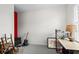 Bedroom space with carpet, guitar, desk, shelving, and lamp near bright window at 861 Murray Ave., Myrtle Beach, SC 29577