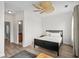 Well-lit bedroom with a ceiling fan, hardwood floors, and adjacent bathroom at 861 Murray Ave., Myrtle Beach, SC 29577