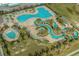 Aerial view of the community pools with various pools, lazy river, and lounge areas at 861 Murray Ave., Myrtle Beach, SC 29577