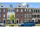 Charming townhouses with brick and white siding exteriors, dormer windows, and landscaped front yards at 861 Murray Ave., Myrtle Beach, SC 29577