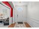 Bright foyer features hardwood floors, white wainscoting, and an arched doorway at 861 Murray Ave., Myrtle Beach, SC 29577