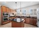 Bright kitchen with stainless steel appliances, dark granite countertops, and an island for additional workspace at 861 Murray Ave., Myrtle Beach, SC 29577