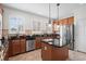 Well-lit kitchen featuring stainless steel appliances, granite countertops, and a central island with storage at 861 Murray Ave., Myrtle Beach, SC 29577