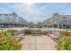 Inviting outdoor seating area with benches and flowers in Market Common at 861 Murray Ave., Myrtle Beach, SC 29577