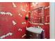 Stylish powder room with a unique crane-themed wallpaper and vanity at 861 Murray Ave., Myrtle Beach, SC 29577