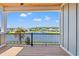 Balcony view of a lake with lush landscaping and a glimpse of neighboring homes at 873 Crystal Water Way, Myrtle Beach, SC 29579