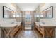 Stylish bathroom boasts dual vanities, decorative tile flooring, and a sleek, modern design at 873 Crystal Water Way, Myrtle Beach, SC 29579