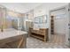 Elegant bathroom featuring a double vanity, patterned tile floor, and luxurious shower with gold fixtures at 873 Crystal Water Way, Myrtle Beach, SC 29579