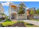 Two-story home with welcoming front porch, two-car garage, manicured lawn, and tasteful landscaping at 873 Crystal Water Way, Myrtle Beach, SC 29579