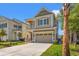 Beautiful two-story home with a concrete driveway, a two car garage, and manicured landscaping at 873 Crystal Water Way, Myrtle Beach, SC 29579