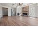 Spacious living room featuring coffered ceilings, fireplace, bar, and staircase access to the second floor at 873 Crystal Water Way, Myrtle Beach, SC 29579