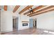 Bright living room showcasing wood beam ceilings, fireplace, and blue doors at 873 Crystal Water Way, Myrtle Beach, SC 29579