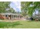 The home features a sunroom, patio, and fenced yard for outdoor enjoyment at 900 47Th Ave. N, Myrtle Beach, SC 29577