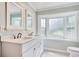 Bright bathroom featuring double sinks, a window and vanity with plenty of counter space at 900 47Th Ave. N, Myrtle Beach, SC 29577