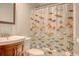 Bathroom with colorful, under-the-sea themed shower curtain, a sink and a toilet at 900 47Th Ave. N, Myrtle Beach, SC 29577