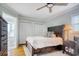 Bedroom with hardwood flooring, dark wood furniture, and access to an ensuite bathroom at 900 47Th Ave. N, Myrtle Beach, SC 29577