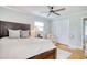 Comfortable bedroom featuring a wooden bed frame, ceiling fan, and natural light at 900 47Th Ave. N, Myrtle Beach, SC 29577