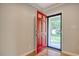 Bright red front door welcomes you into this charming home at 900 47Th Ave. N, Myrtle Beach, SC 29577
