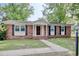 Charming brick home with a well-maintained lawn and inviting front entrance at 900 47Th Ave. N, Myrtle Beach, SC 29577