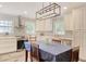 Bright kitchen with stainless steel appliances, white cabinetry and a dining table at 900 47Th Ave. N, Myrtle Beach, SC 29577