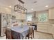 Updated kitchen with white cabinets, stainless appliances, and a dining area at 900 47Th Ave. N, Myrtle Beach, SC 29577