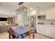 Open concept kitchen with stainless steel refrigerator, microwave, and view into the living room at 900 47Th Ave. N, Myrtle Beach, SC 29577