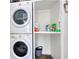 Efficient laundry area with stackable washer and dryer, and storage shelves at 900 47Th Ave. N, Myrtle Beach, SC 29577
