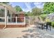 Outdoor patio space featuring a table with chairs and a grill, perfect for outdoor entertaining at 900 47Th Ave. N, Myrtle Beach, SC 29577