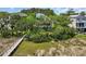 Beautiful home with mature trees and a private dock at 92 High Hammock Way, Pawleys Island, SC 29585