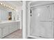 Bathroom features a double sink vanity, shower, and neutral tile floors at 92 High Hammock Way, Pawleys Island, SC 29585