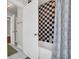 Upstairs bath with tiled shower/tub combo and additional storage at 92 High Hammock Way, Pawleys Island, SC 29585