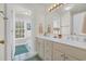 Bright bathroom with double vanity, great natural light, and separate water closet at 92 High Hammock Way, Pawleys Island, SC 29585