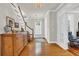 Bright foyer with hardwood floors, staircase, and stylish furnishings, creating a warm and welcoming ambiance at 92 High Hammock Way, Pawleys Island, SC 29585
