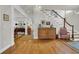 Inviting foyer boasts hardwood floors with compass design, complemented by elegant furnishings and a staircase at 92 High Hammock Way, Pawleys Island, SC 29585