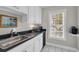 Charming kitchenette featuring stainless appliances and a window view at 92 High Hammock Way, Pawleys Island, SC 29585