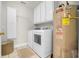 Laundry room boasts a washer, dryer and plenty of cabinet space at 92 High Hammock Way, Pawleys Island, SC 29585