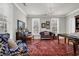 Comfortable living room showcases a large area rug, piano, and lots of natural light at 92 High Hammock Way, Pawleys Island, SC 29585