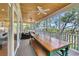The screened-in porch provides outdoor living space with wood ceiling and neighborhood views at 92 High Hammock Way, Pawleys Island, SC 29585