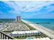 Breathtaking aerial view of the condo building, beach, pier, and surrounding cityscape under a partly cloudy sky at 9650 Shore Dr. # 2207, Myrtle Beach, SC 29572