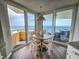Inviting breakfast nook with floor-to-ceiling windows and ocean views at 9650 Shore Dr. # 2207, Myrtle Beach, SC 29572
