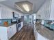 Modern kitchen with stainless steel appliances, granite counters, and access to a breakfast nook with an ocean view at 9650 Shore Dr. # 2207, Myrtle Beach, SC 29572