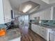 Modern kitchen with stainless steel appliances, white cabinets, granite counters, and access to the ocean-view breakfast nook at 9650 Shore Dr. # 2207, Myrtle Beach, SC 29572