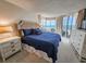 Relaxing main bedroom with a cozy sitting area, ocean views, and ample natural light at 9650 Shore Dr. # 2207, Myrtle Beach, SC 29572